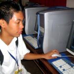 Young boy high school student from philippines using computers (Cyberpsychology: Adolescent Public Health in the United States)